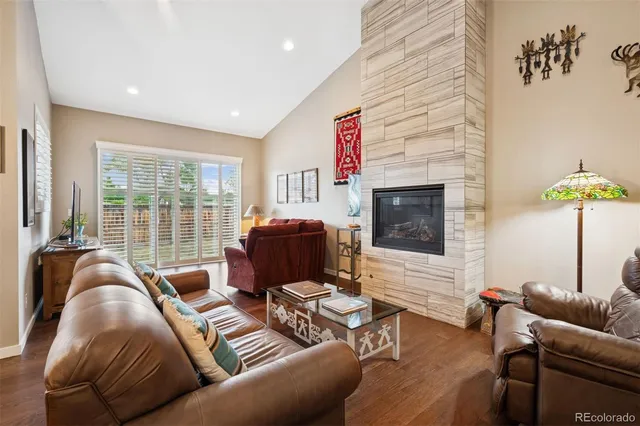 a living room with furniture window and a flat screen tv