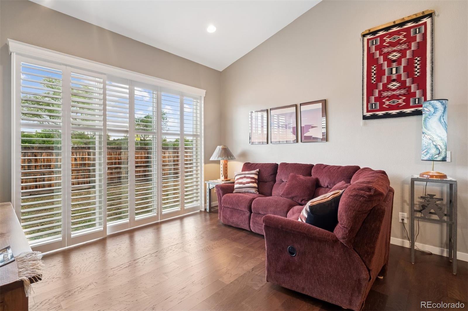 5795 Xenon Way Arvada, CO 80002 - Photo 9 of 33 a living room with furniture and a large window
