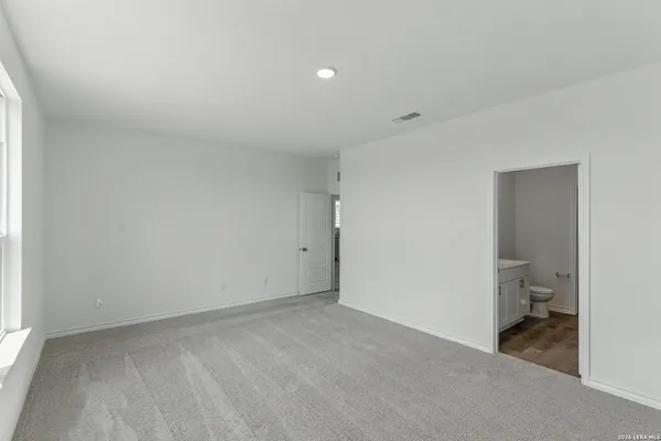 a view of a room with a hallway and a toilet
