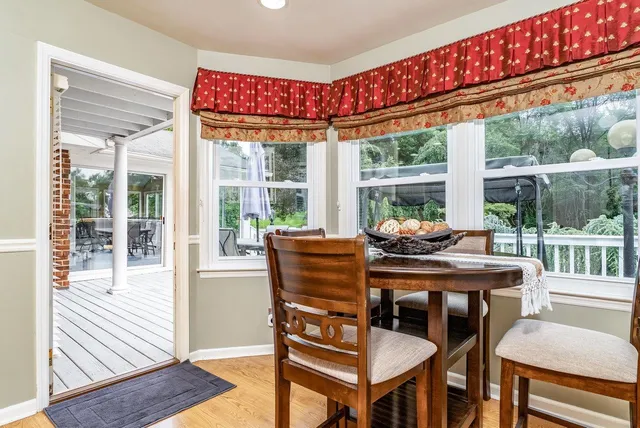 a view of a chairs and table in the balcony