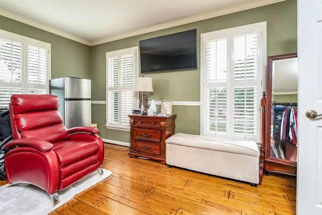 a bathroom with a toilet a sink and a mirror