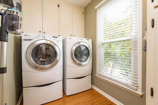 a view of an entryway with wooden floor