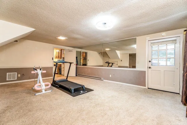 a front view of a house with a yard table and chairs