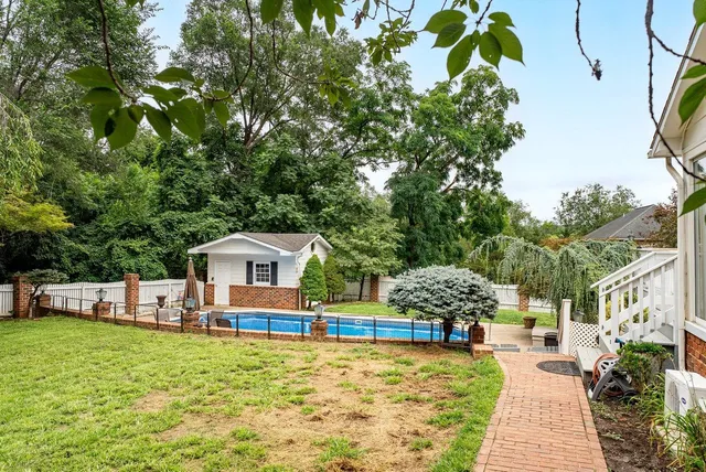 a view of a patio with a table chairs and a table