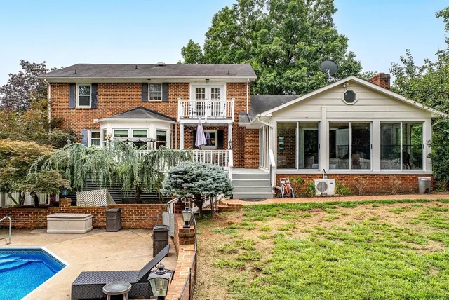a balcony with table and chairs