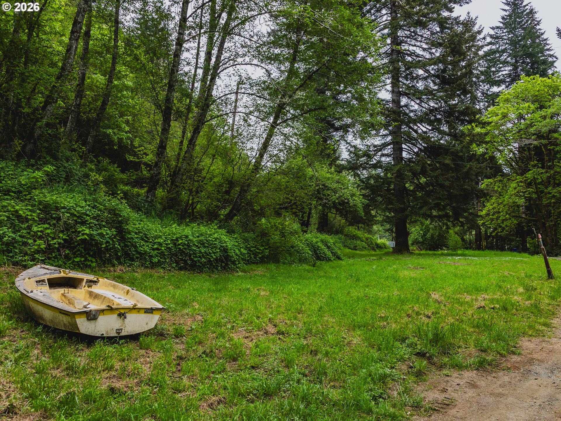 1100 North New Bridge Road Otis, OR 97368 - Photo 11 of 28 a view of a backyard with swimming pool