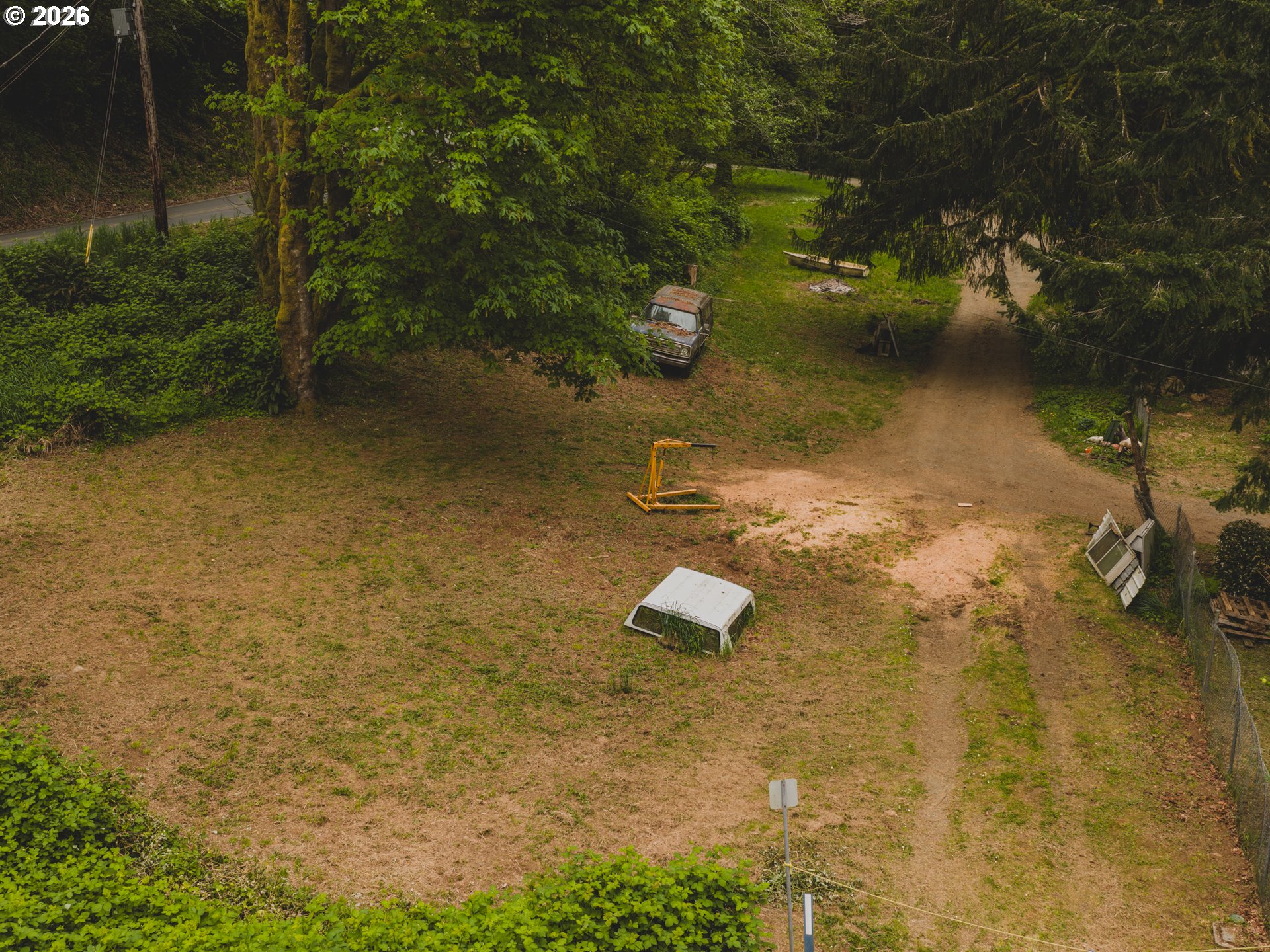 1100 North New Bridge Road Otis, OR 97368 - Photo 5 of 28 an aerial view of a house with a yard