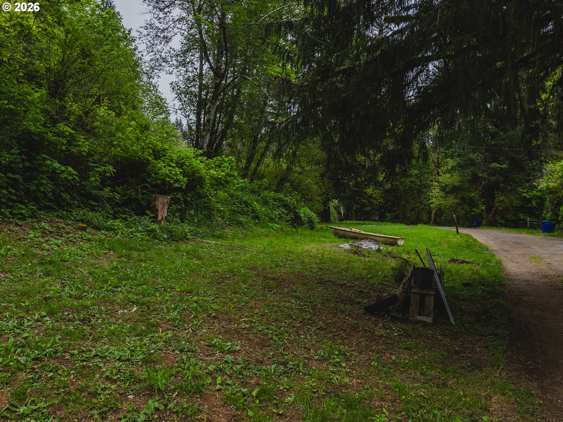 1100 North New Bridge Road Otis, OR 97368 - Photo 8 of 28 a view of a bench in a park