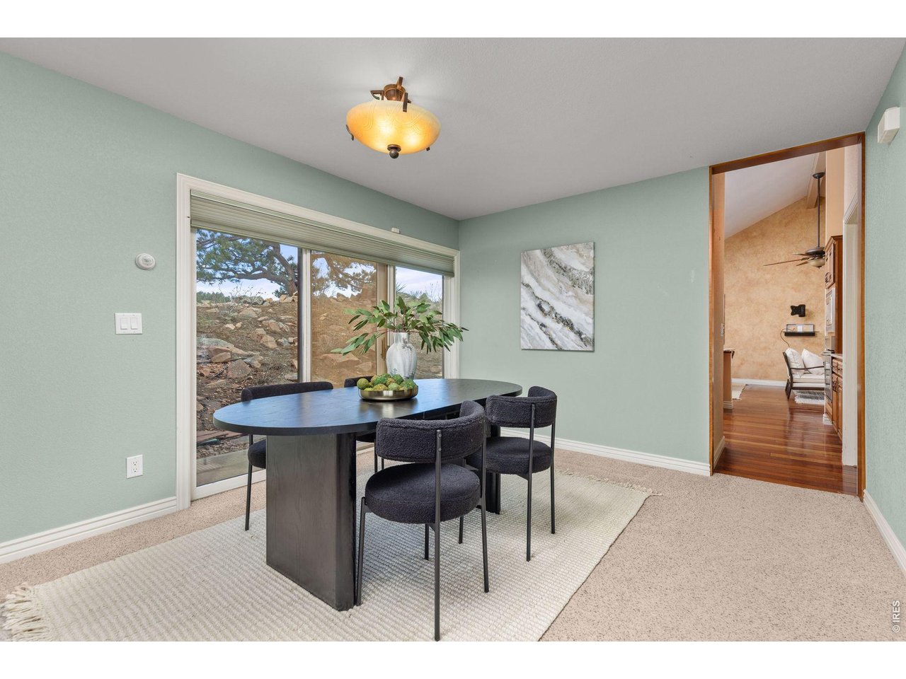 6183 Red Hill Road Boulder, CO 80302 - Photo 12 of 49 a view of a dining room with furniture and a window