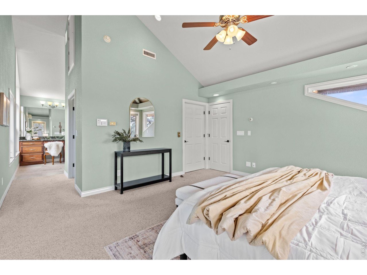 6183 Red Hill Road Boulder, CO 80302 - Photo 33 of 49 a bedroom with a bed and a chandelier