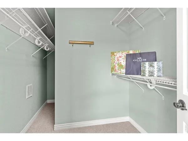 a view of a living room and kitchen