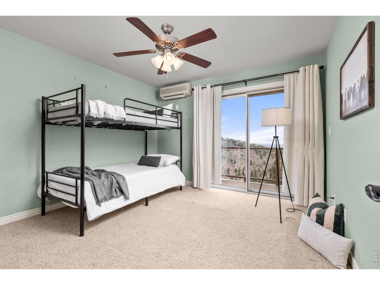 6183 Red Hill Road Boulder, CO 80302 - Photo 42 of 49 a bedroom with a bed and a chandelier