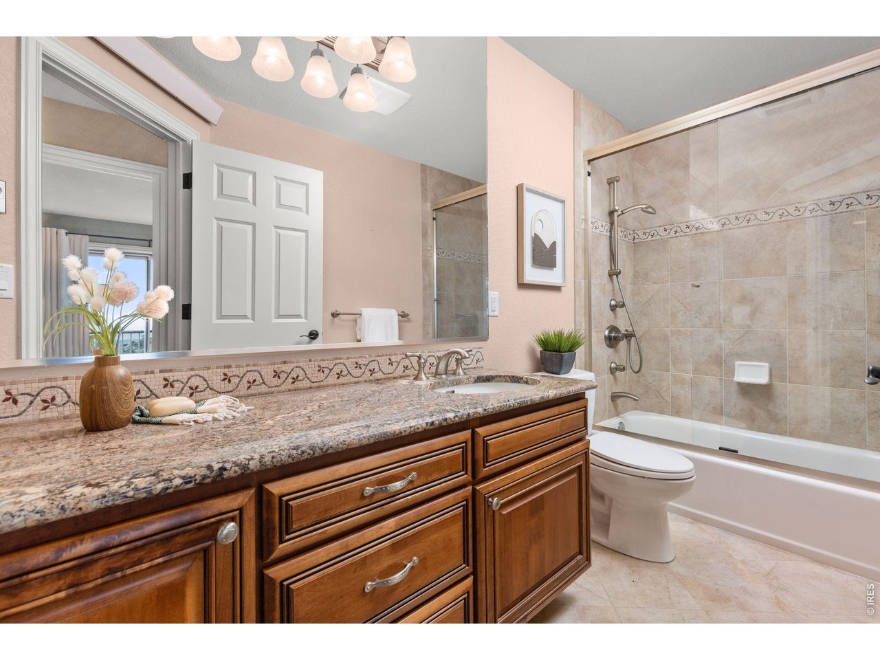 6183 Red Hill Road Boulder, CO 80302 - Photo 43 of 49 a bathroom with a granite countertop sink a toilet a mirror and bathtub