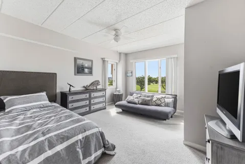 a bedroom with a bed and a couch