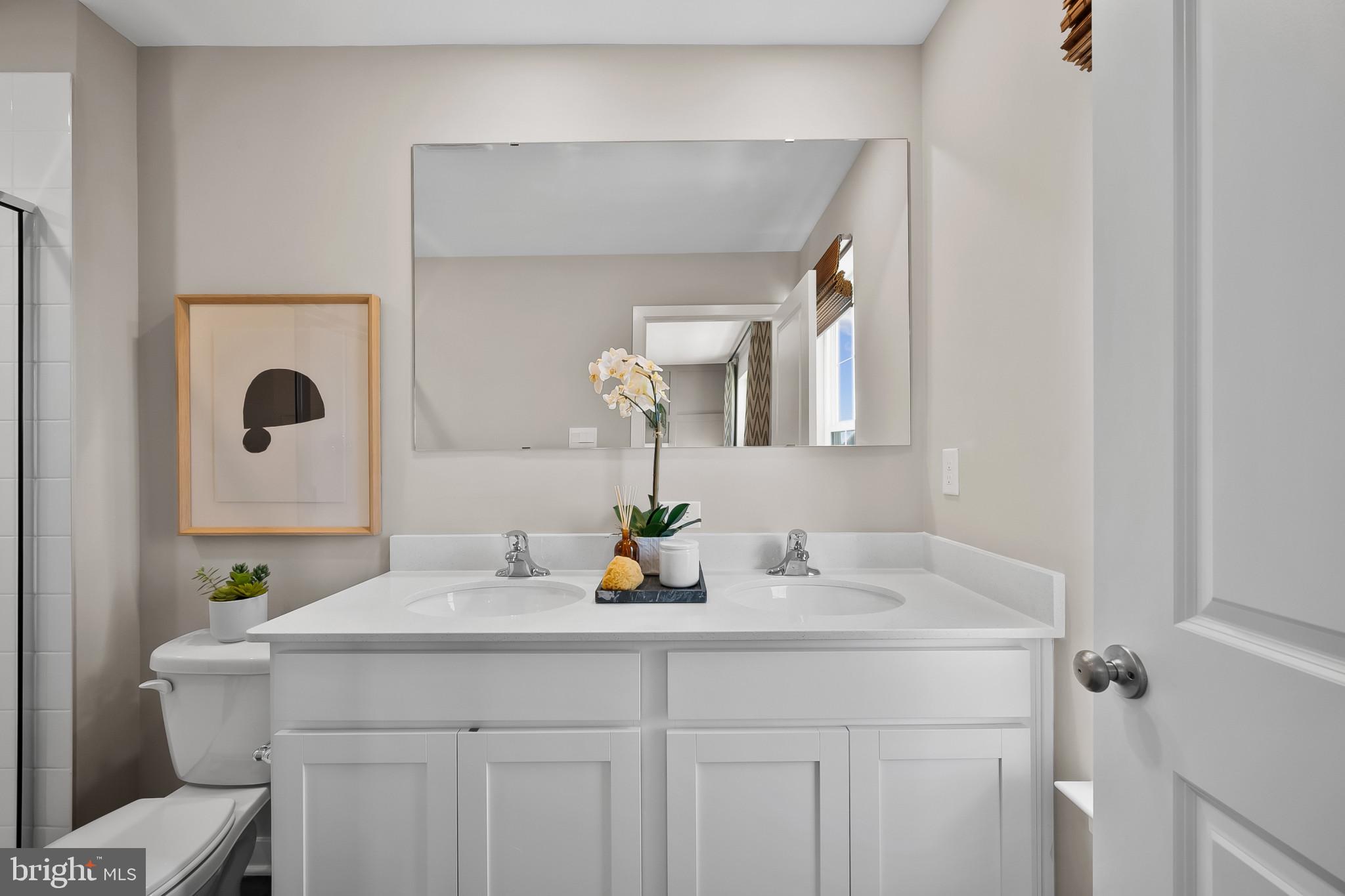 409 Eclipse Street Ranson, WV 25438 - Photo 29 of 46 a bathroom with a sink and a mirror