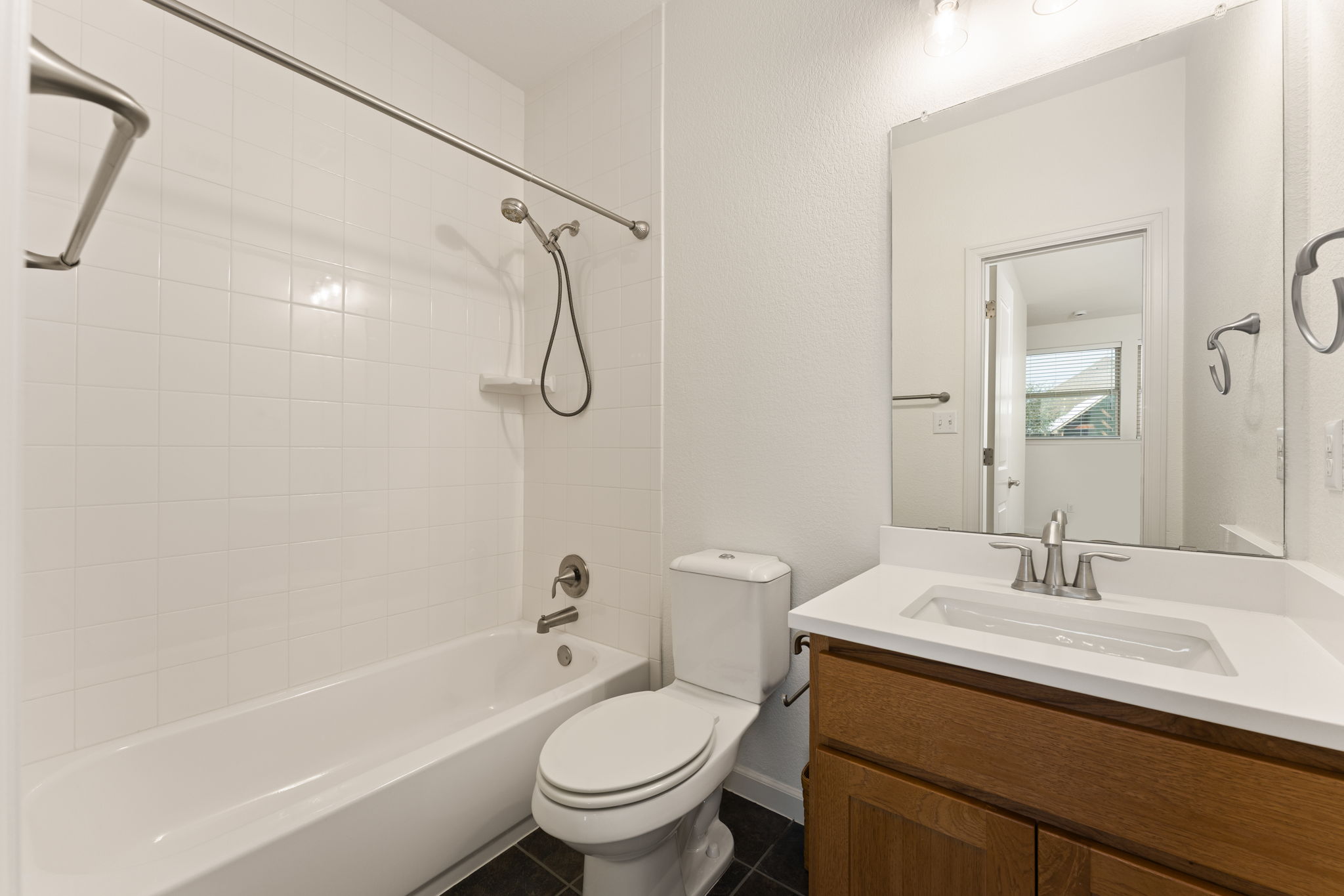 5701 Cherokee Draw Road Austin, TX 78738 - Photo 14 of 33 The full upstairs guest bathroom.