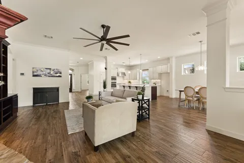 a living room with furniture and a fireplace