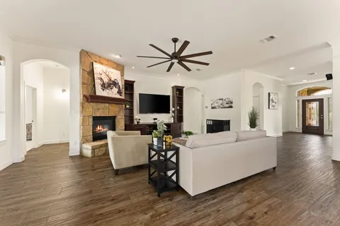 a living room with furniture and a fireplace