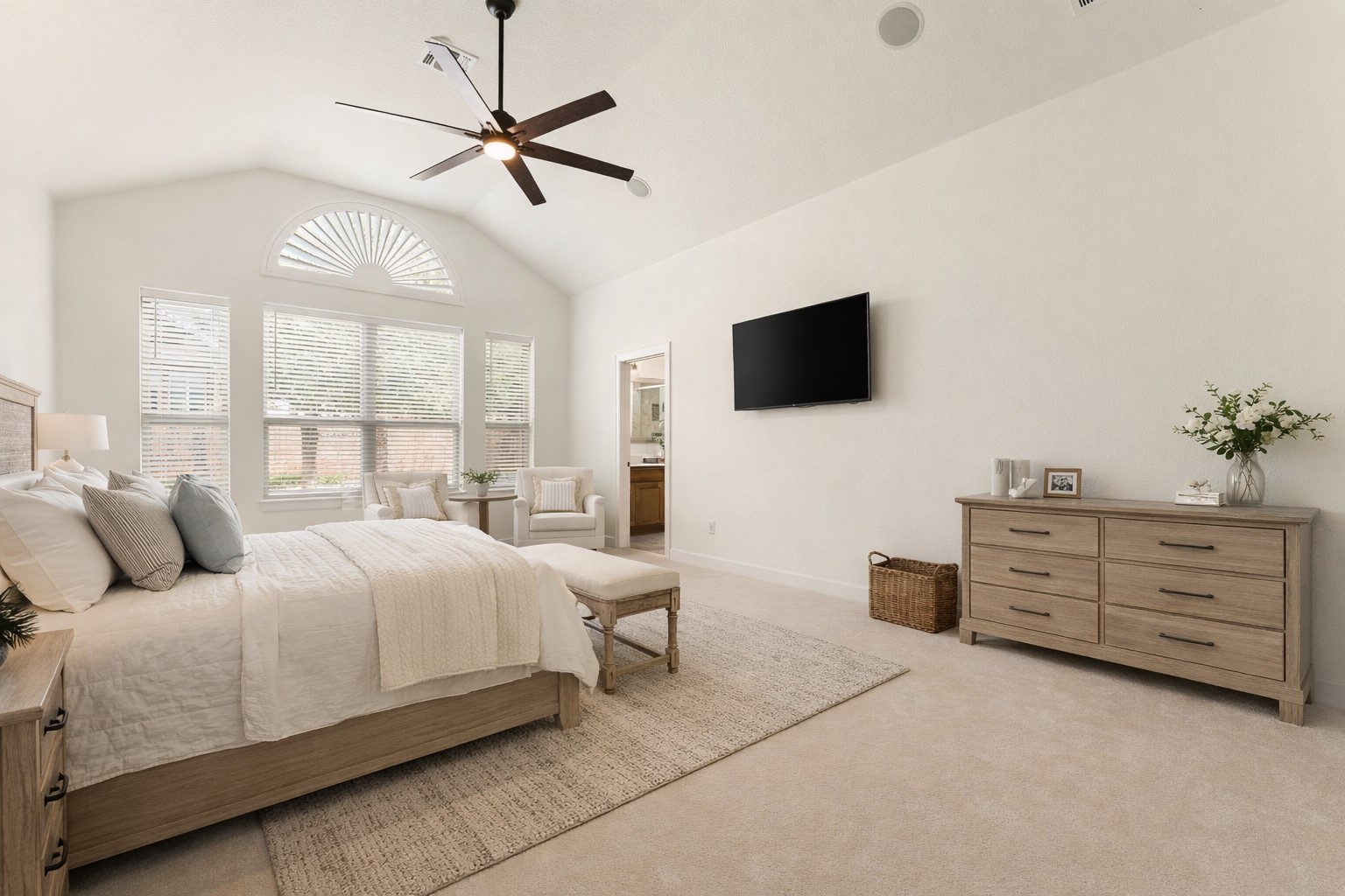 5701 Cherokee Draw Road Austin, TX 78738 - Photo 5 of 33 The spacious primary suite overlooks the backyard. Virtually staged.