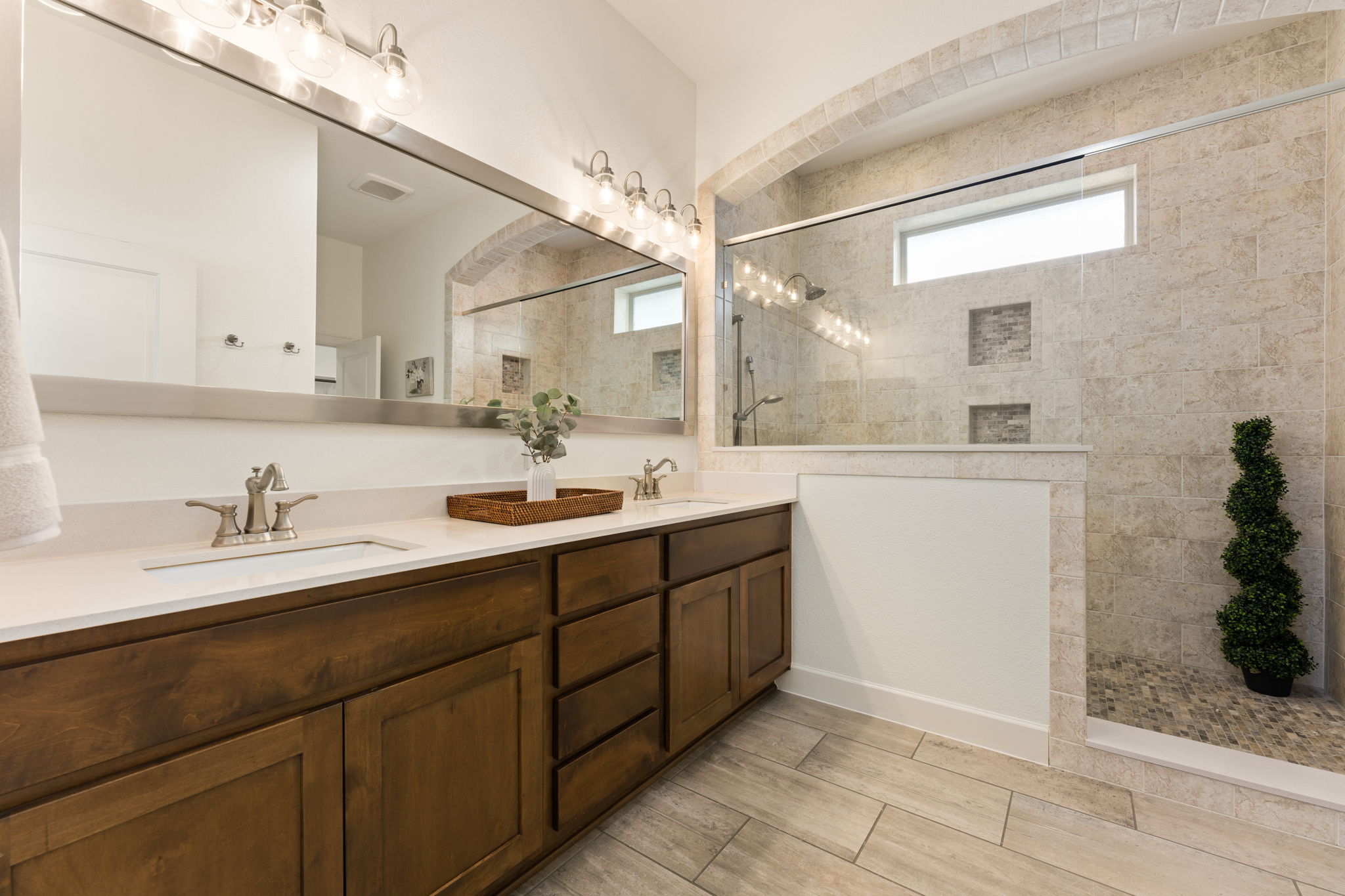 5701 Cherokee Draw Road Austin, TX 78738 - Photo 6 of 33 The primary bathroom features quartz counters, a double vanity, new lighting, and a huge custom shower.