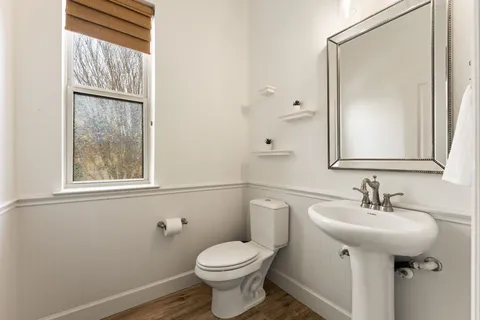 a living room with furniture cabinets and window