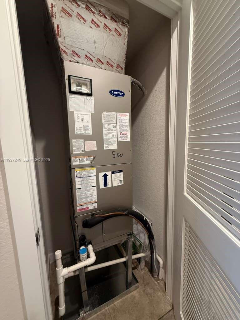 1037 Northwest 5th Street, Unit 1037 Florida City, FL 33034 - Photo 12 of 14 a view of an empty room with a window