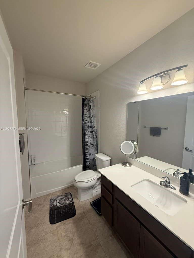 1037 Northwest 5th Street, Unit 1037 Florida City, FL 33034 - Photo 7 of 14 a bathroom with a double vanity sink toilet and shower