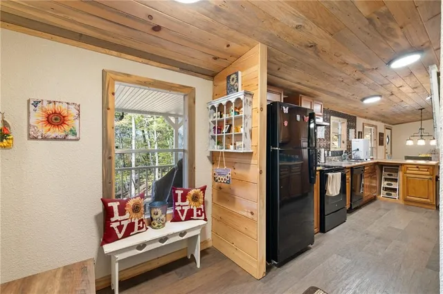 a view of game room with window and refrigerator