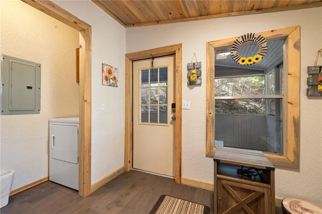 a view of an entryway with wooden floor