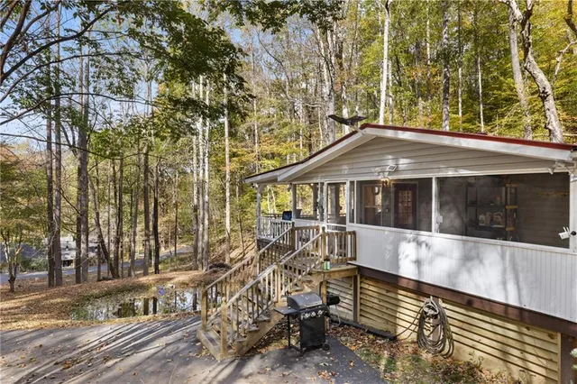 a view of house with a yard