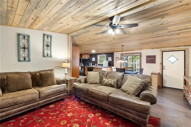 a view of a living room a rug and a couch