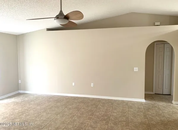 a view of a utility room with racks on the wall