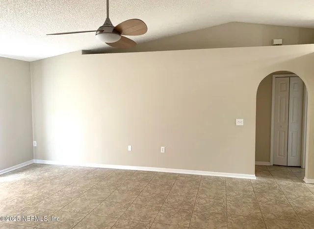 a view of a utility room with racks on the wall