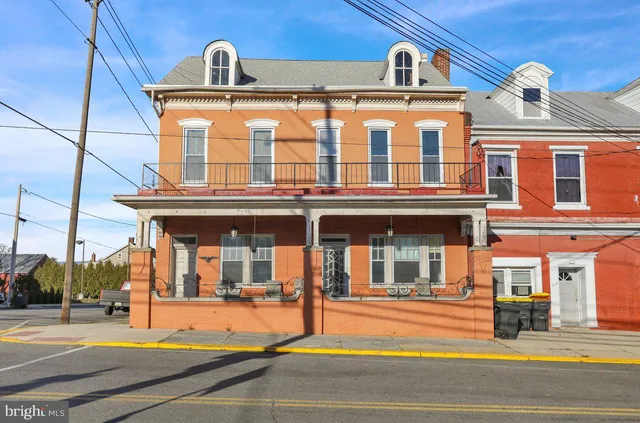 a view of a building with a porch