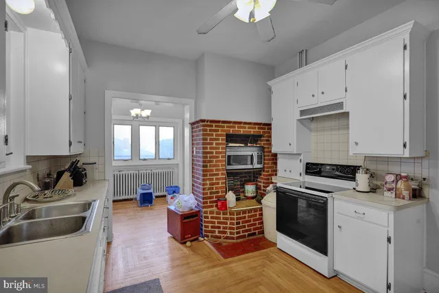 a kitchen with sink and cabinets
