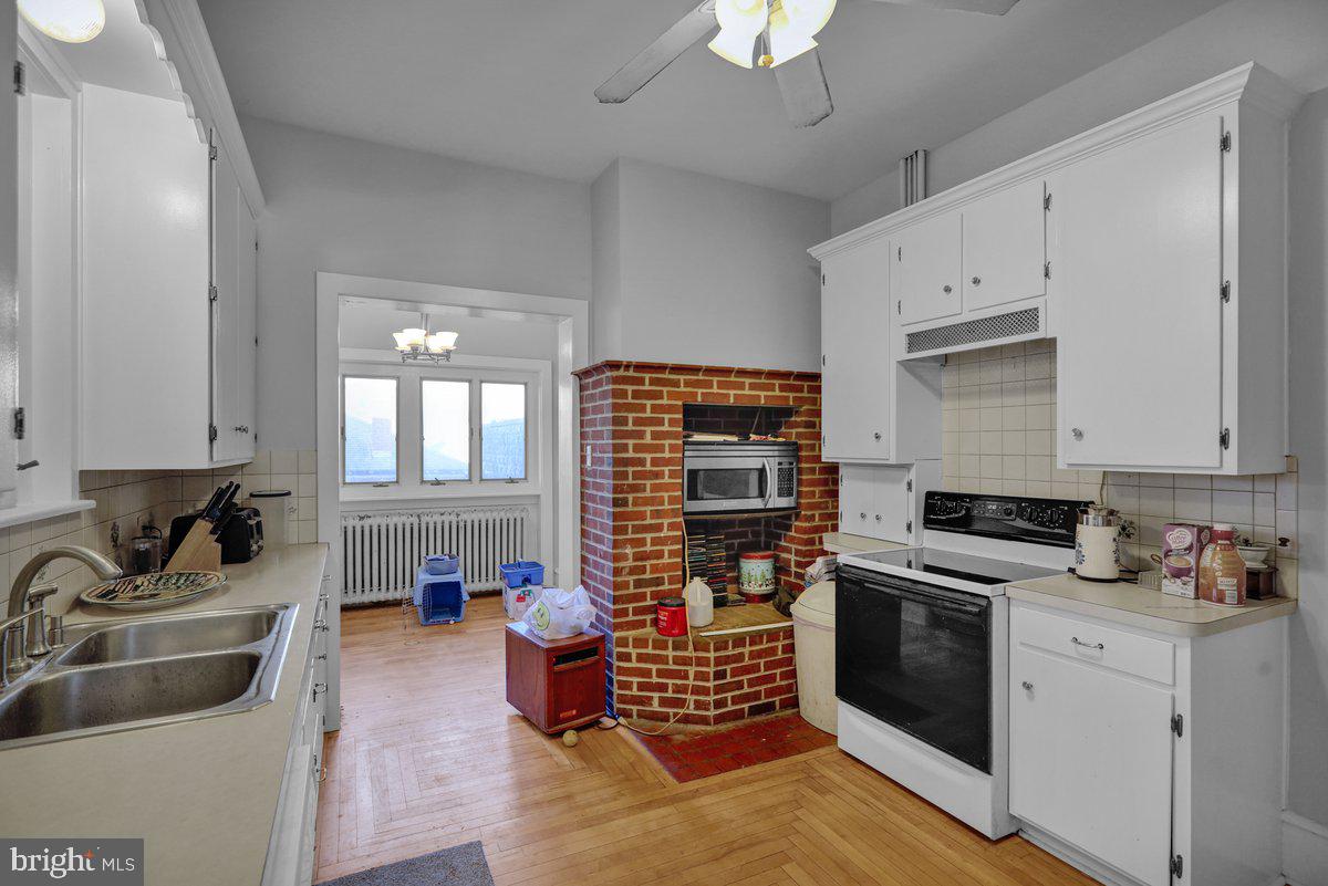 161 West High Street Womelsdorf, PA 19567 - Photo 12 of 37 a kitchen with granite countertop a sink stainless steel appliances and cabinets