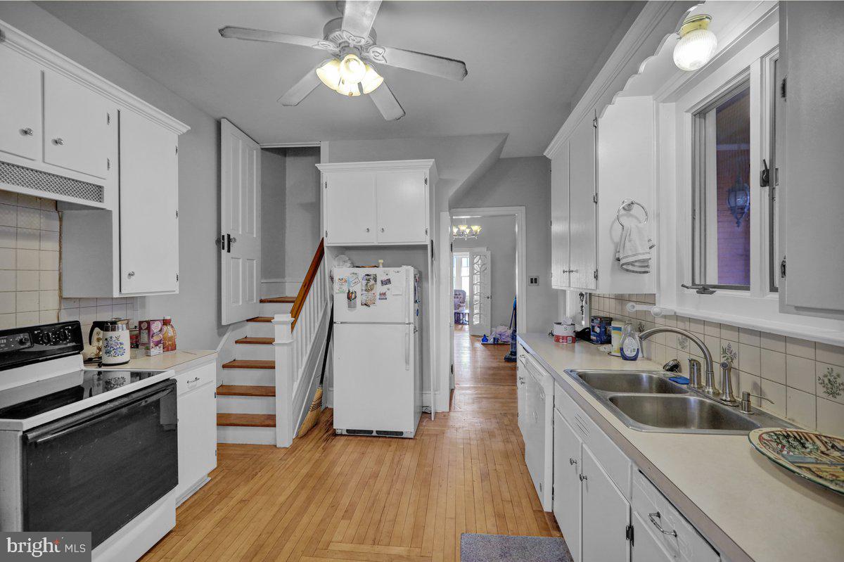161 West High Street Womelsdorf, PA 19567 - Photo 13 of 37 a kitchen with granite countertop a sink cabinets and stainless steel appliances