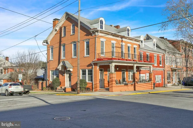 a front view of a building with street view