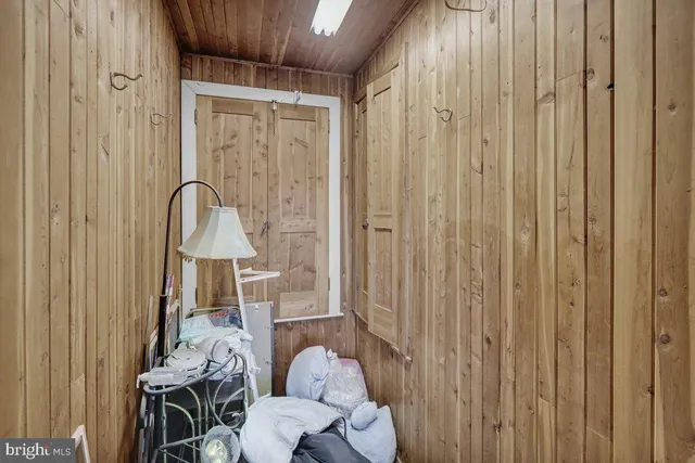 a living room with a sink furniture and a dining table