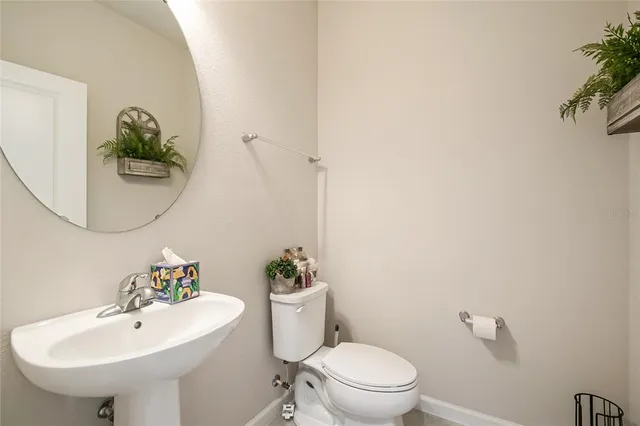 a kitchen with kitchen island granite countertop a sink a counter top space appliances and cabinets