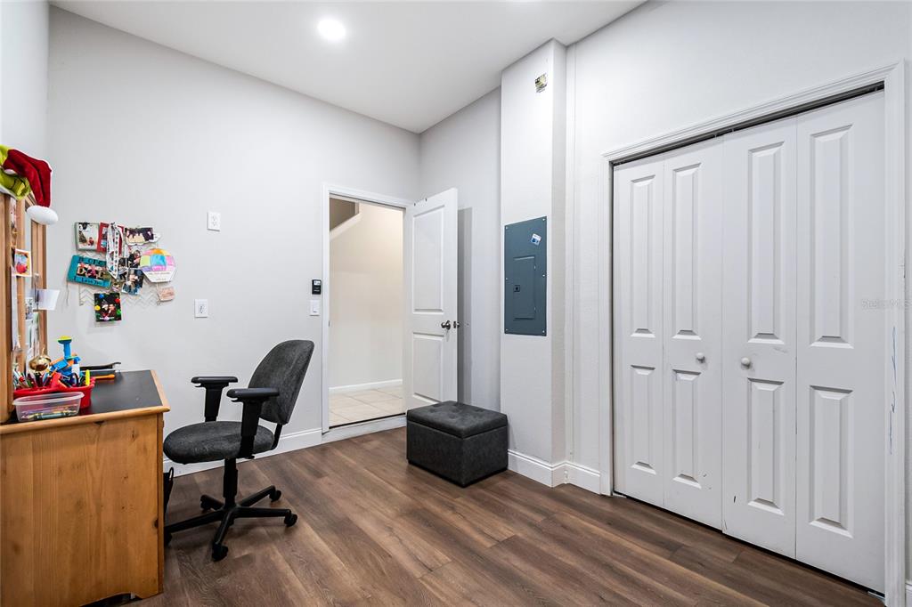 1943 Holden Ridge Ln. Clermont, FL 34715 - Photo 13 of 59 a view of a workspace with furniture and a window