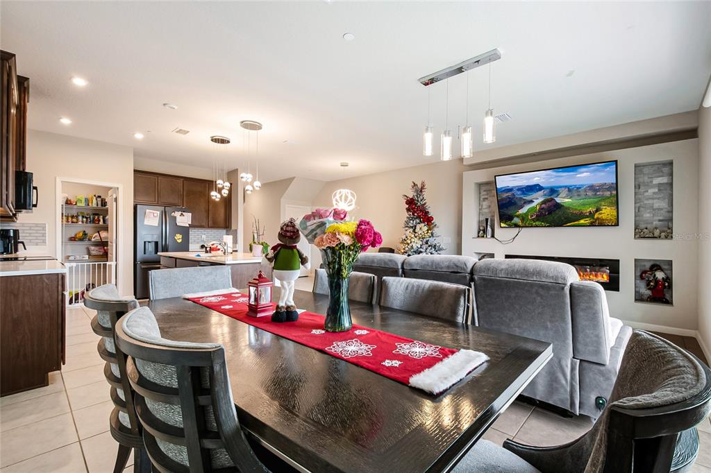 1943 Holden Ridge Ln. Clermont, FL 34715 - Photo 20 of 59 a living room with furniture and kitchen view