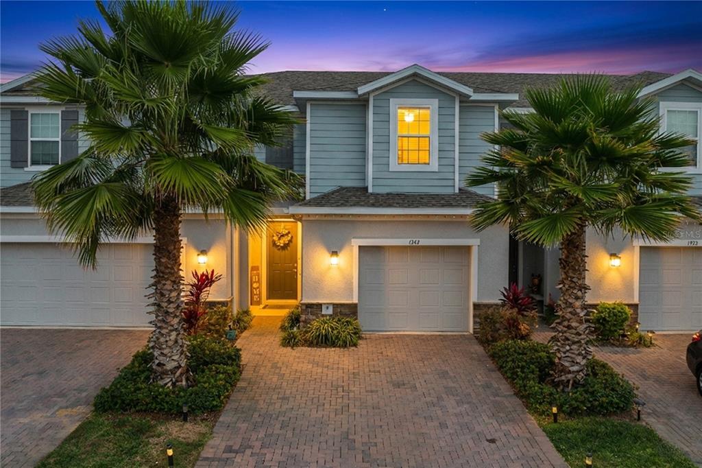1943 Holden Ridge Ln. Clermont, FL 34715 - Photo 2 of 59 a front view of house with yard and green space