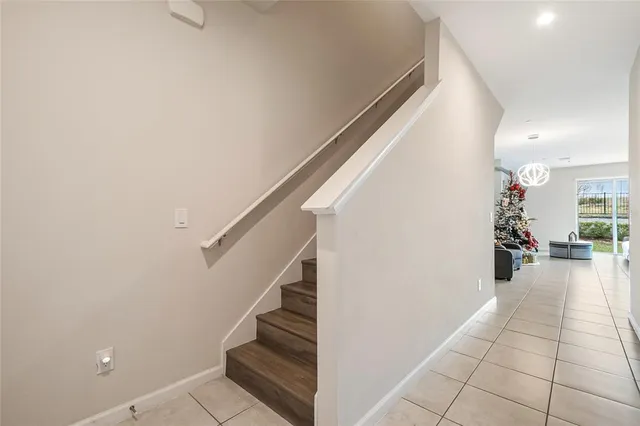 a bedroom with a bed a flat screen tv and dresser