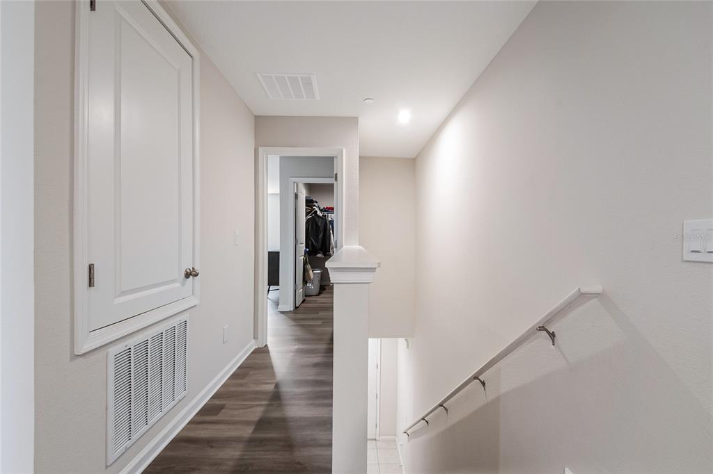 1943 Holden Ridge Ln. Clermont, FL 34715 - Photo 33 of 59 a view of a hallway with a wooden floor and entryway