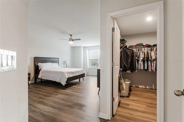 a bathroom with a sink a toilet a mirror and shower