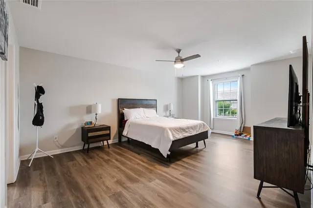 an empty room with wooden floor