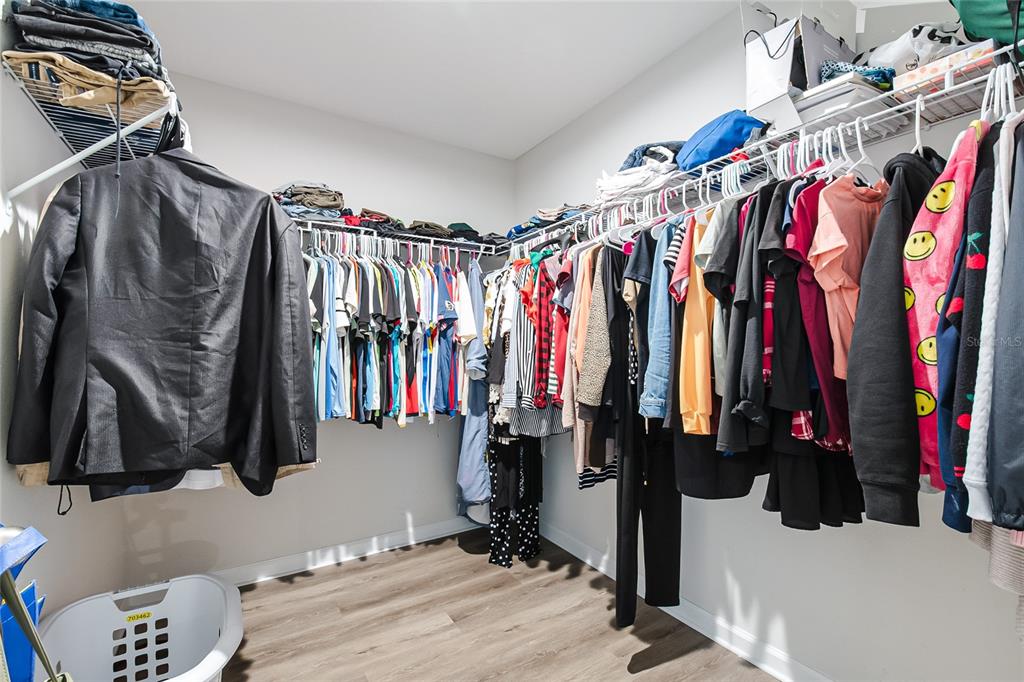 1943 Holden Ridge Ln. Clermont, FL 34715 - Photo 39 of 59 a view of walk in closet with clothes and shoes