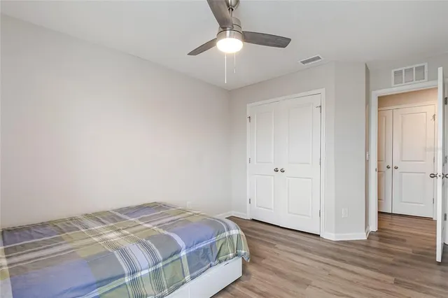 an aerial view of a house with a lake