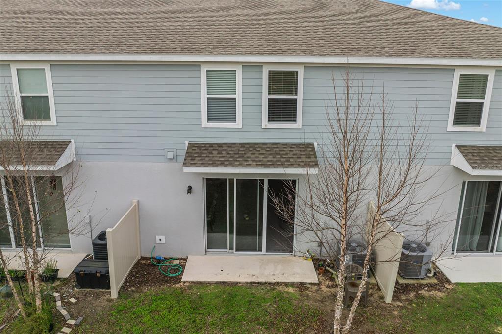 1943 Holden Ridge Ln. Clermont, FL 34715 - Photo 49 of 59 a front view of a house with a yard